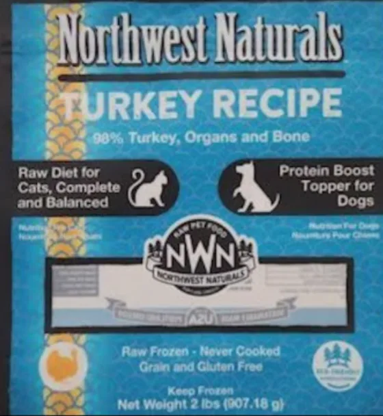 A close-up of a Northwest Naturals pet food bag labeled 'Turkey Recipe' with text indicating it's 98% turkey, organs, and…