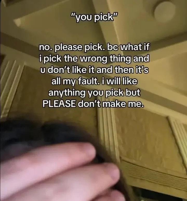 A close-up shot shows a person's hand resting near their face, looking stressed or overwhelmed, with overlaid text that…