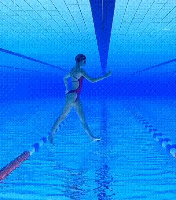 A grid of six underwater photos shows a woman in a red swimsuit walking in a swimming pool lane, her legs and arms moving in…