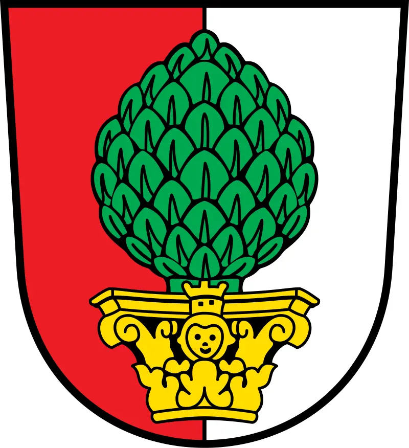 A coat of arms featuring a green pinecone centered on a red and white shield, with a yellow ornate base holding a smiling…