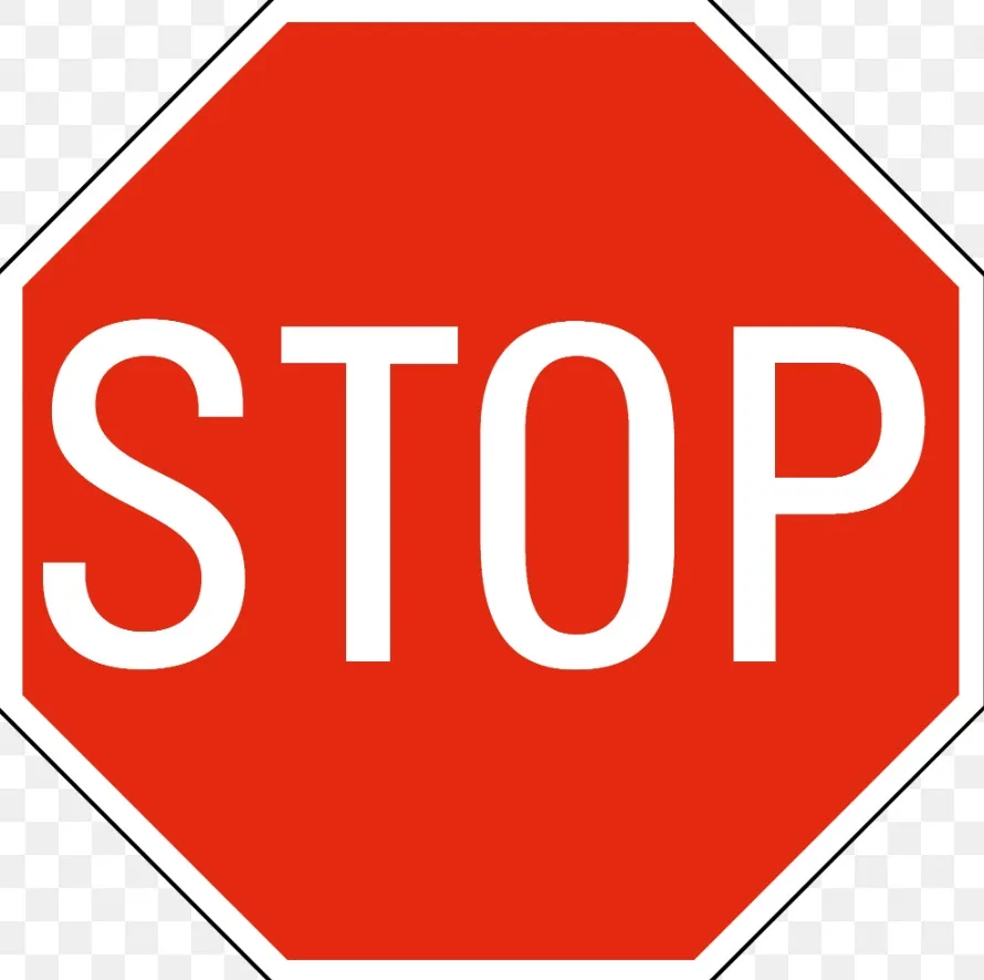 A standard red octagonal stop sign with bold white uppercase letters spelling 'STOP' centered on the sign. The sign has a…