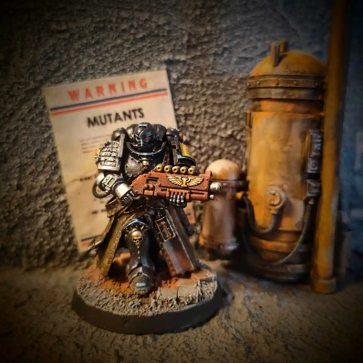 A heavily armored, grim-faced miniature warrior with glowing red eyes and a bolt-action weapon stands on a rocky base…