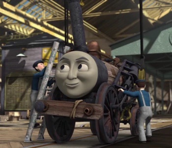 A cartoon steam engine with a smug, self-satisfied expression is being worked on by two men in a train station. One man is…