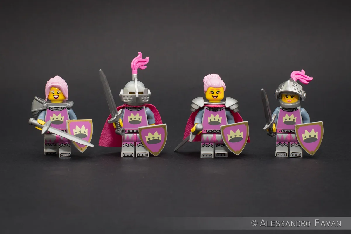 four lego knights in pink armor holding swords and shields stand in a row against a dark background. The overlaid text reads…