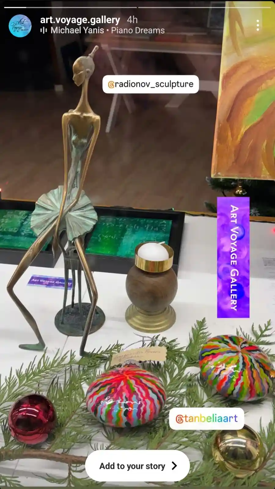 A social media post from 'art.voyage.gallery' shows a display of art including a tall, slender bronze sculpture of a…