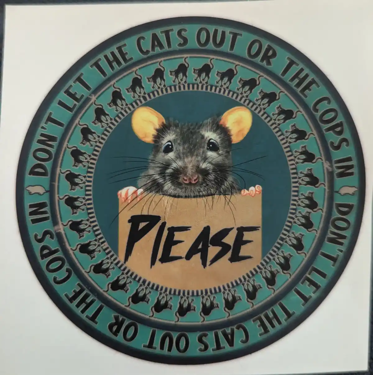 A circular sticker features a cartoon rat holding a cardboard sign that says 'PLEASE'. The rat has large orange ears and…