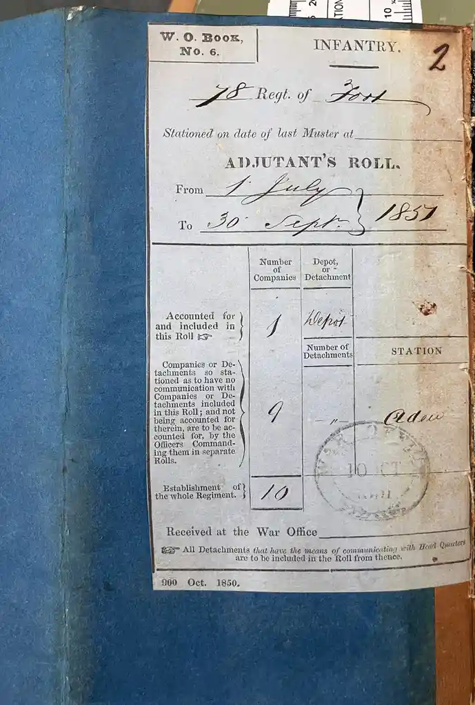 A close-up of an old, yellowed military document titled 'ADJUTANT'S ROLL' from 1857, showing handwritten entries for the…