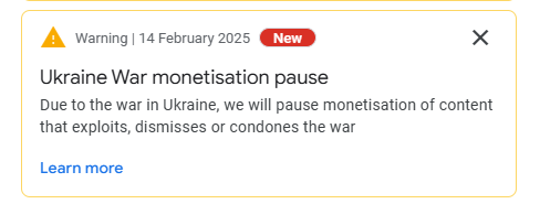 A mock warning notification from a platform dated February 14, 2025, titled 'Ukraine War monetisation pause,' stating that…