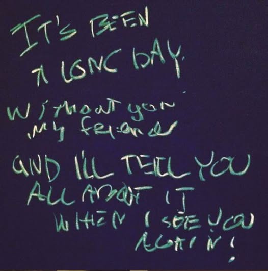 Handwritten text in green marker on a dark purple background reads: 'IT'S BEEN A LONG DAY WITHOUT YOU MY FRIEND AND I'LL…