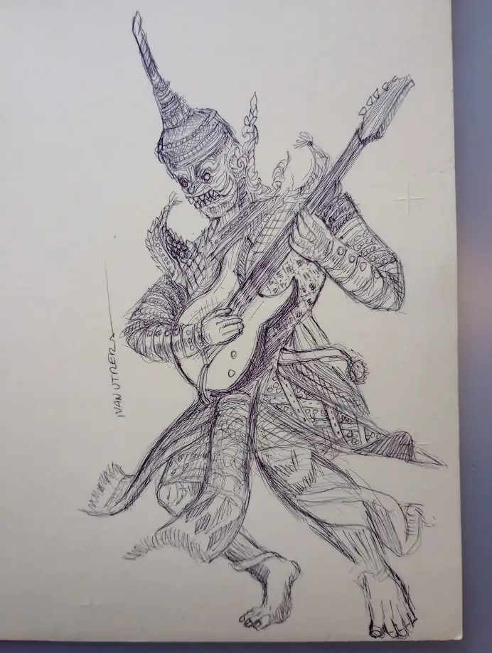 A detailed black-and-white pencil sketch depicts a demonic figure with a traditional Thai-style headdress, sharp teeth, and…