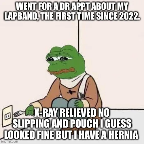 A green frog character, known as Pepe the Frog, sits at a table with a fork and knife, looking sad and defeated. The text…
