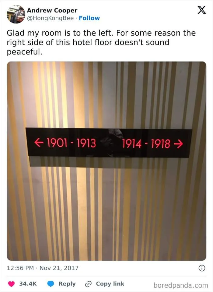 A photo of a hotel hallway sign with red LED text showing '← 1901 - 1913' and '1914 - 1918 →'. The sign is mounted on a wall…