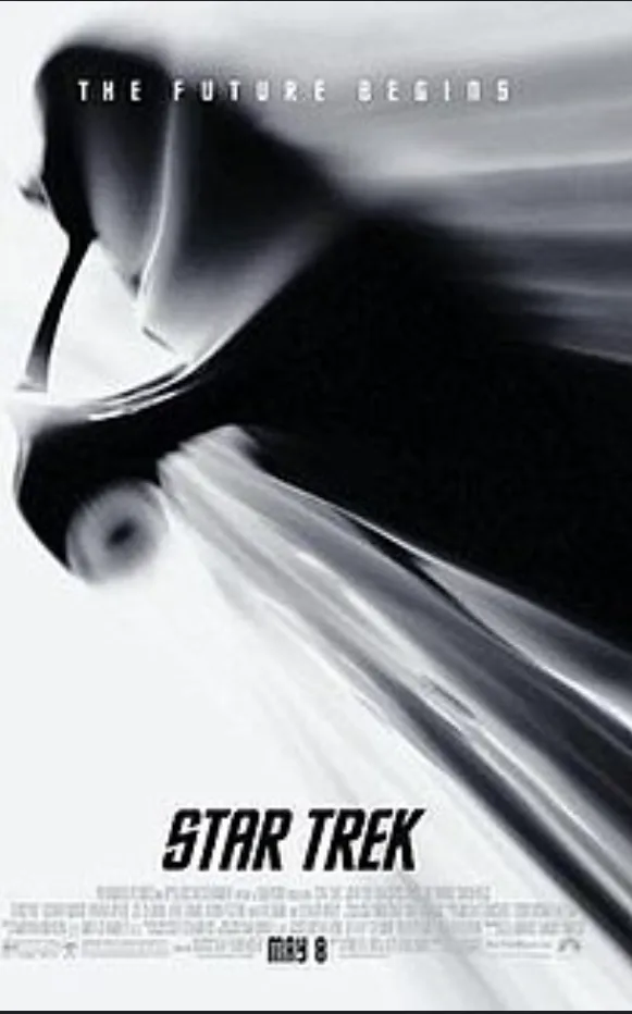 A black and white movie poster for 'Star Trek' featuring a blurred, motion-filled image of a spaceship, with the tagline…