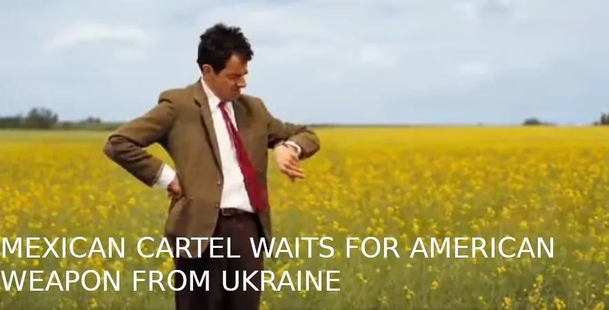 A man in a brown suit and red tie stands in a field of yellow flowers, looking at his watch with one hand on his hip. White…