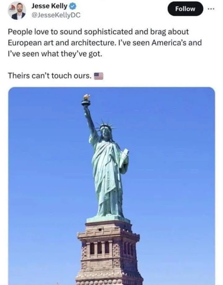 A screenshot of a tweet by Jesse Kelly showing a photo of the Statue of Liberty against a clear blue sky. The tweet text…