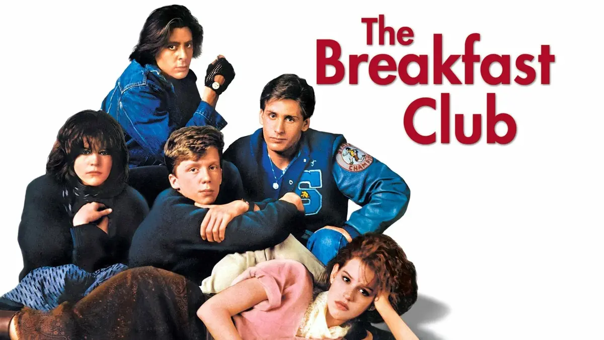 The poster for the 1985 film 'The Breakfast Club' features five teenagers in distinct 1980s outfits posing with serious…