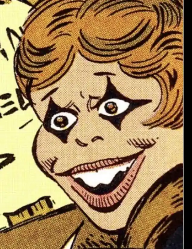 A close-up comic book panel shows a character with exaggerated, manic facial features: wide, star-shaped eyes, a wide grin…