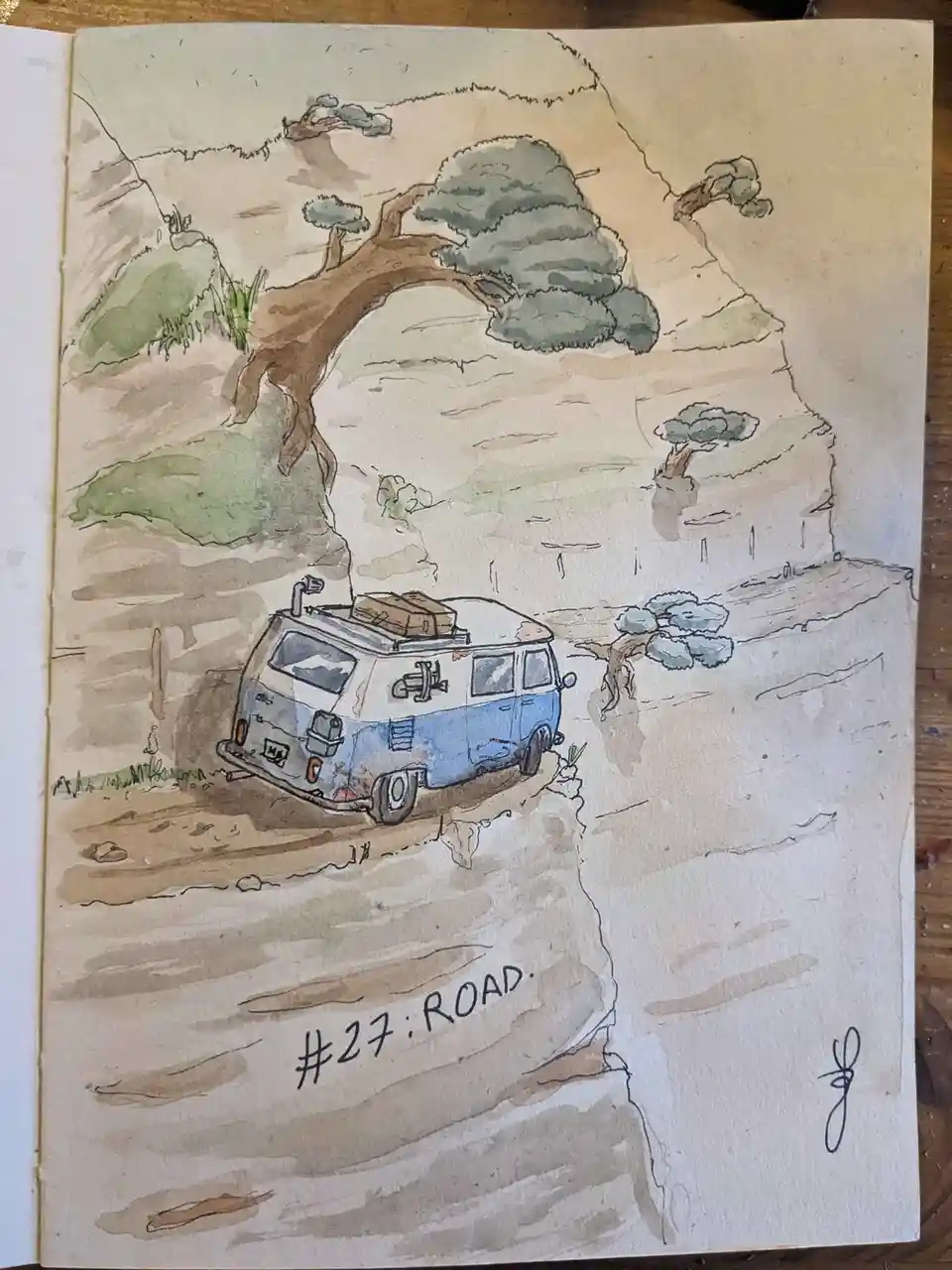 A watercolor sketch depicts a blue and white vintage van parked on a narrow, precarious dirt road clinging to the edge of a…