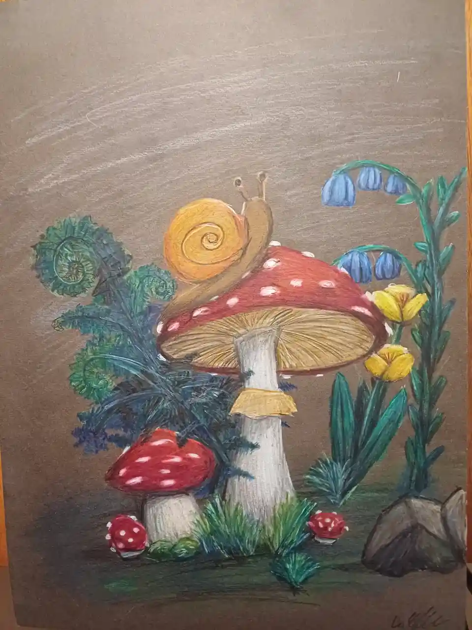 A colorful crayon drawing depicts a snail with a yellow spiral shell resting atop a large red-and-white spotted mushroom…
