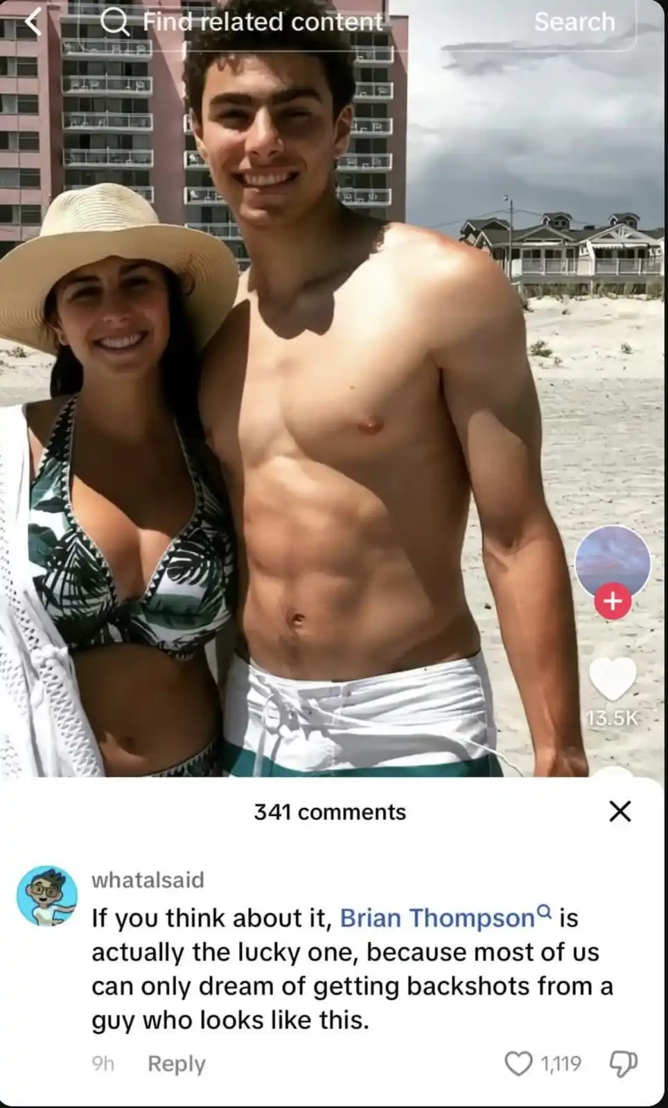 A shirtless, muscular man with defined abs stands on a beach next to a smiling woman in a bikini and straw hat. The image is…