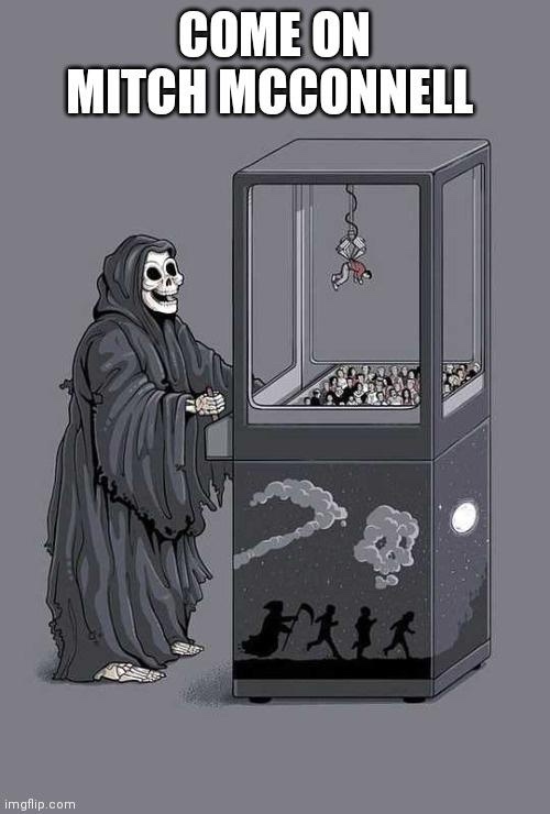 A grim reaper stands beside a large, transparent machine resembling a gumball or prize machine. Inside the machine, a crowd…