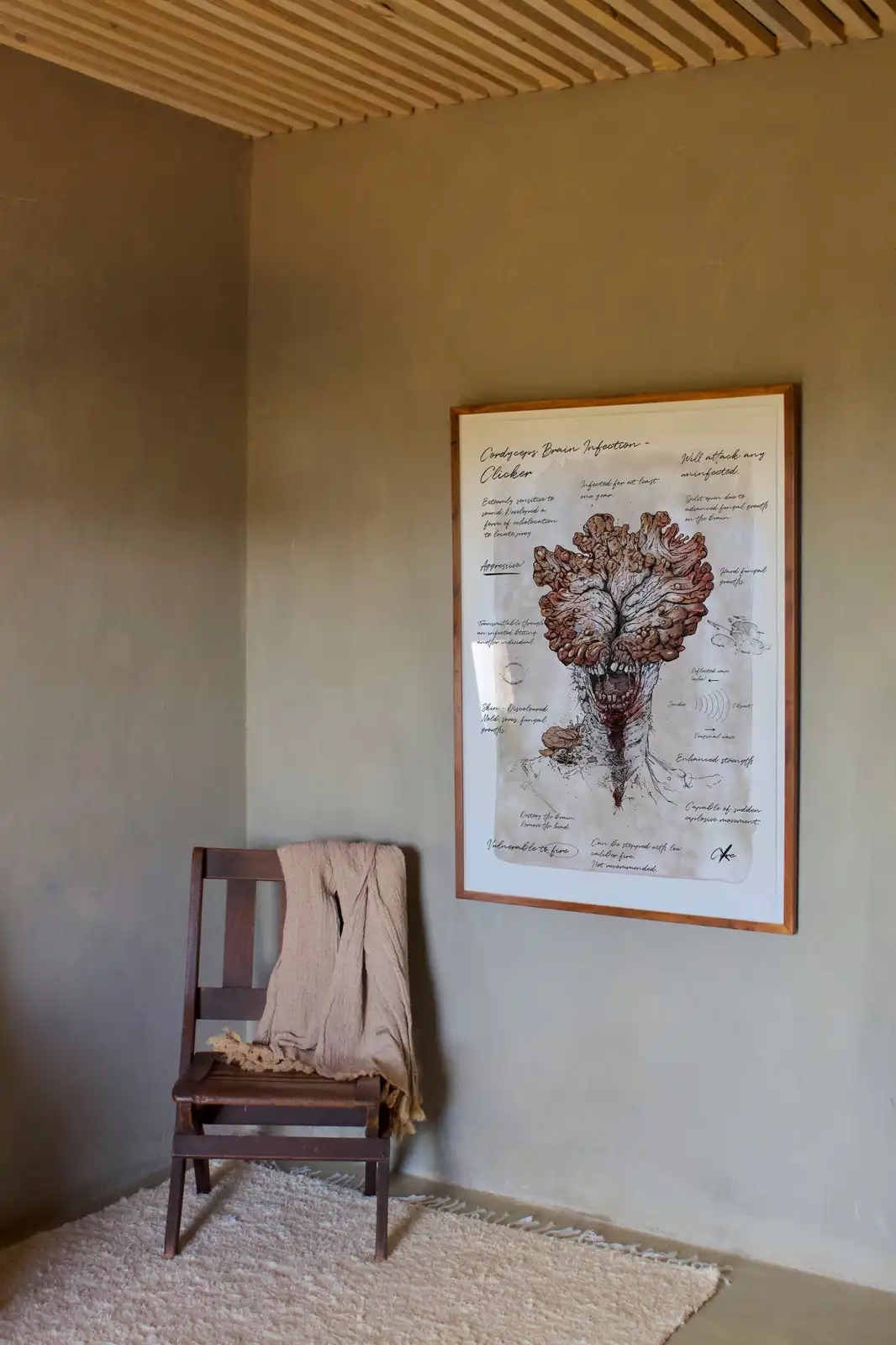 A framed, detailed anatomical diagram of a 'Cordyceps Brain Infection - Clicker' from the game 'Left 4 Dead' hangs on a…