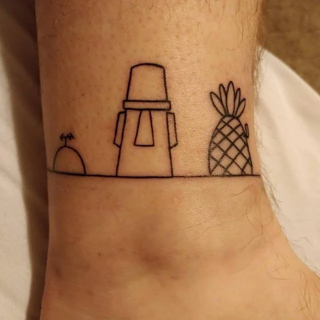 A minimalist black ink tattoo on a person's ankle depicts three stylized objects: a small dome-shaped structure on the left…