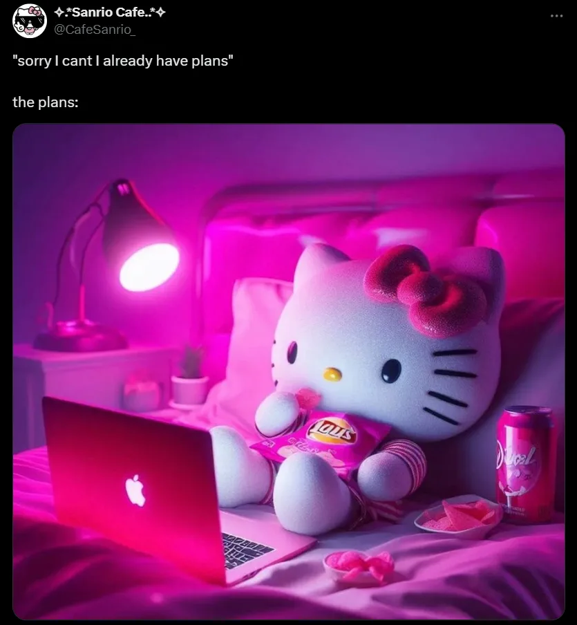 A large Hello Kitty plush toy sits on a bed in a pink-lit room, using a laptop, holding a bag of Lay's chips, with a can of…
