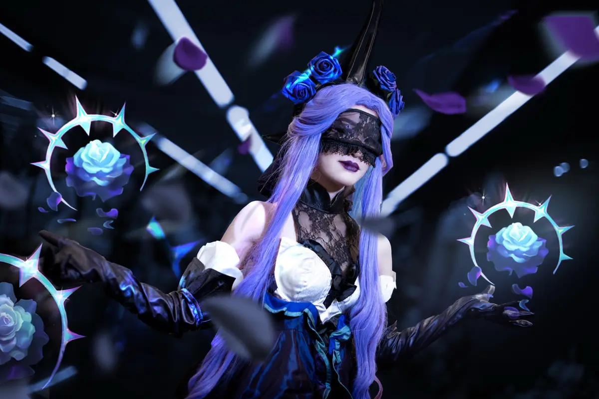 A person with long purple hair and a black lace blindfold is posing in a dark, stylized setting with glowing blue roses and…