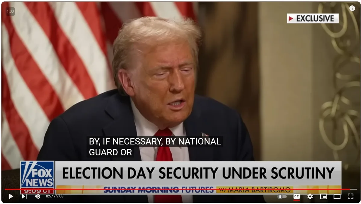 A still from a Fox News interview shows Donald Trump speaking with a serious expression, an American flag visible behind…