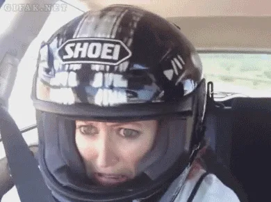 A six-panel sequence shows a person wearing a black Shoei motorcycle helmet inside a car, transitioning from a neutral…