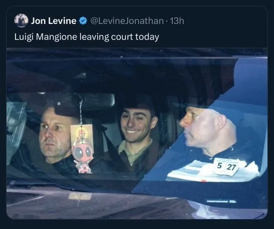 A screenshot of a tweet by Jon Levine showing a photo of Luigi Mangione smiling in the backseat of a car, with a man in the…