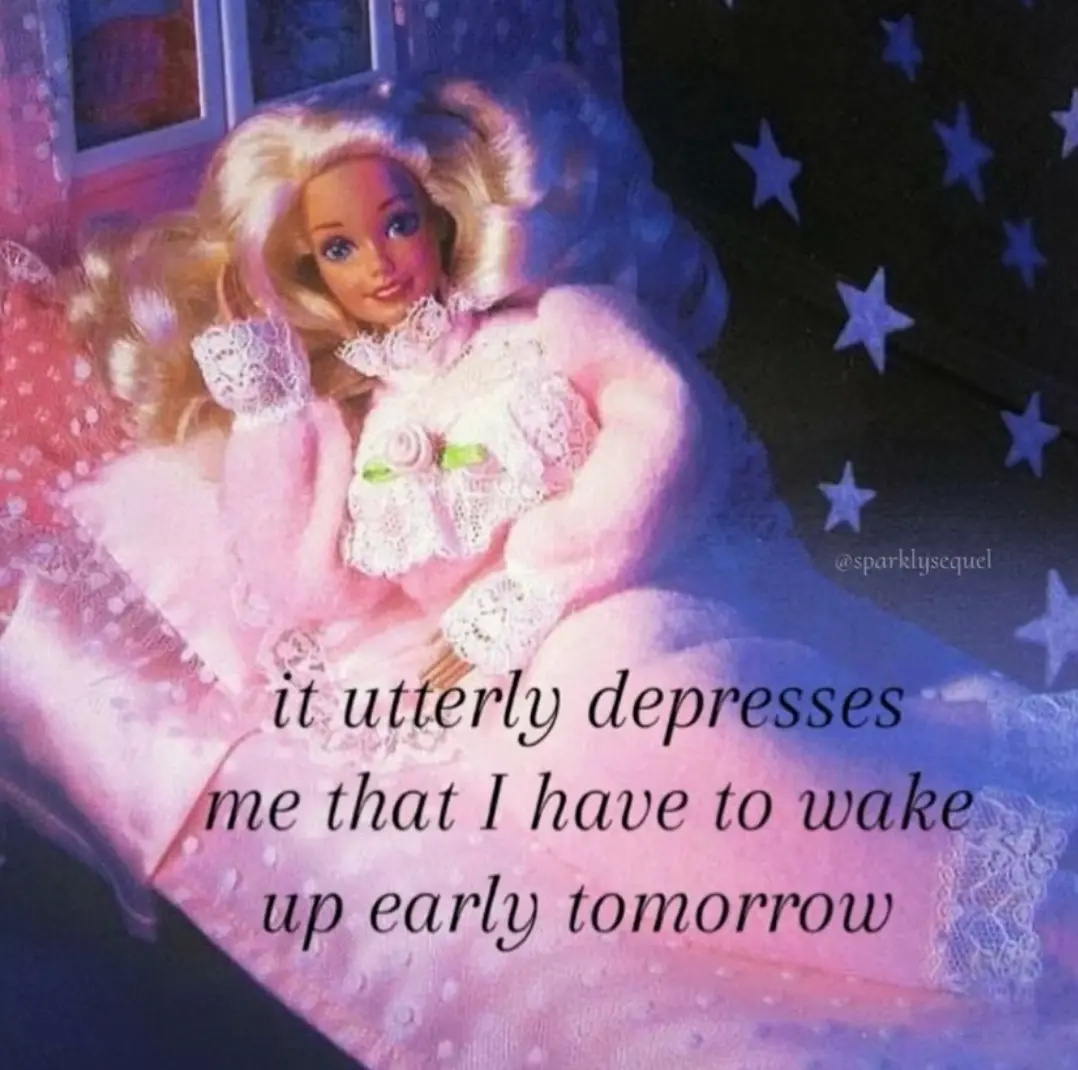 A doll with blonde hair and a pink lace dress lies in bed under a starry night sky, looking sad. The text overlaid on the…