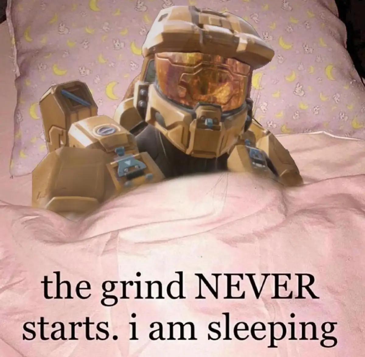 A golden-armored Halo Master Chief is shown lying in bed, partially covered by a pink blanket, with a pink pillow featuring…