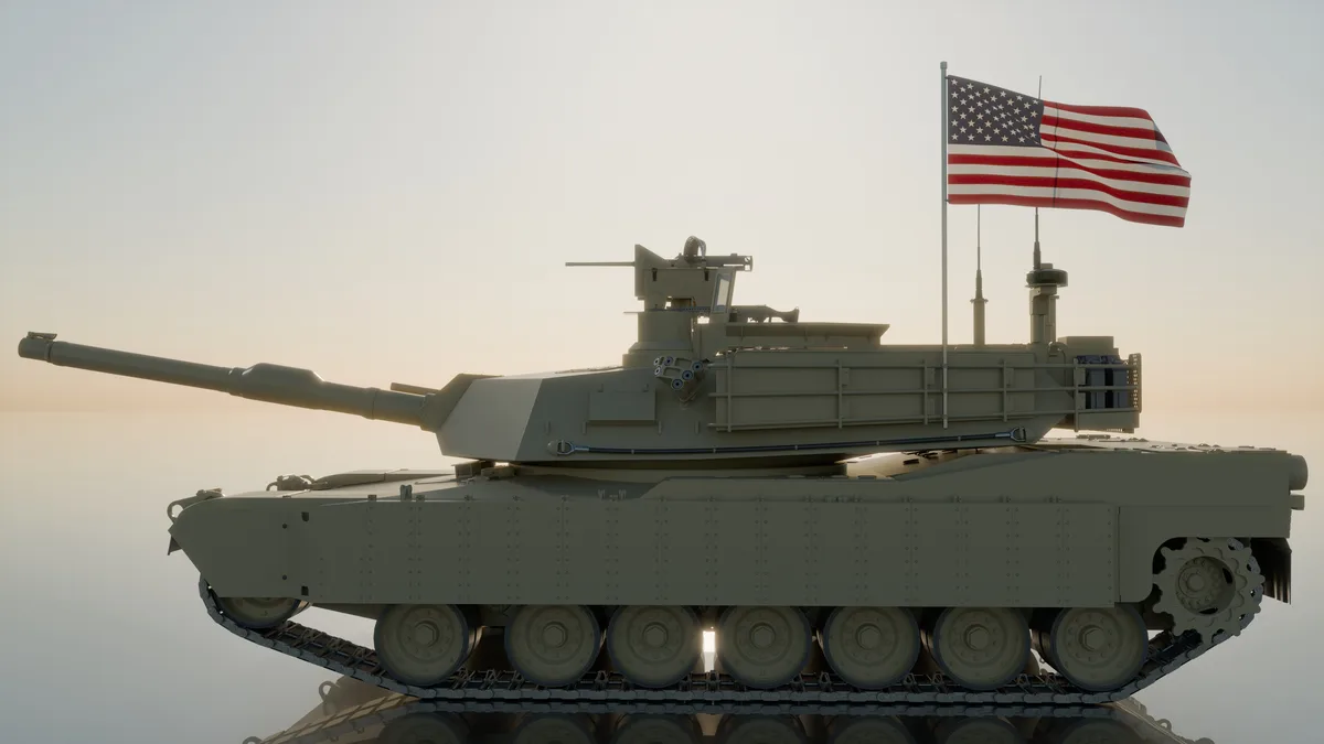 A digitally rendered, olive-drab military tank with a large American flag mounted on its turret, set against a hazy…