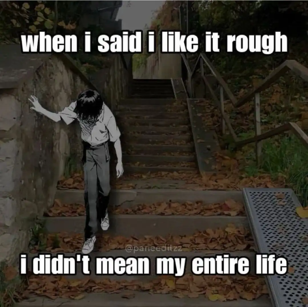 A person in black and white anime-style clothing is shown struggling to climb a long, steep, leaf-covered outdoor staircase…