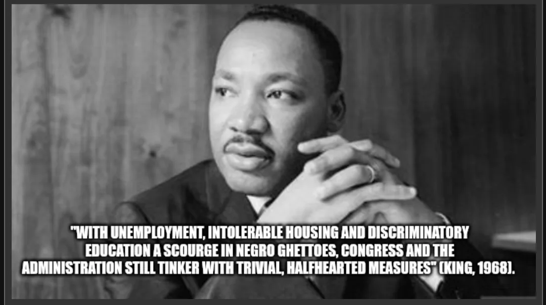 A black-and-white photo of Martin Luther King Jr. looking thoughtful with his hands clasped. Overlaid text quotes him from…