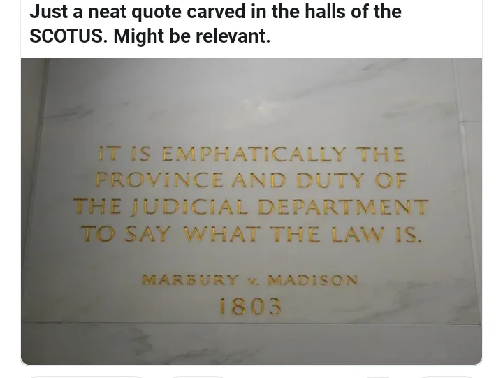 A close-up photo shows gold lettering on a white marble wall, quoting 'IT IS EMPHATICALLY THE PROVINCE AND DUTY OF THE…