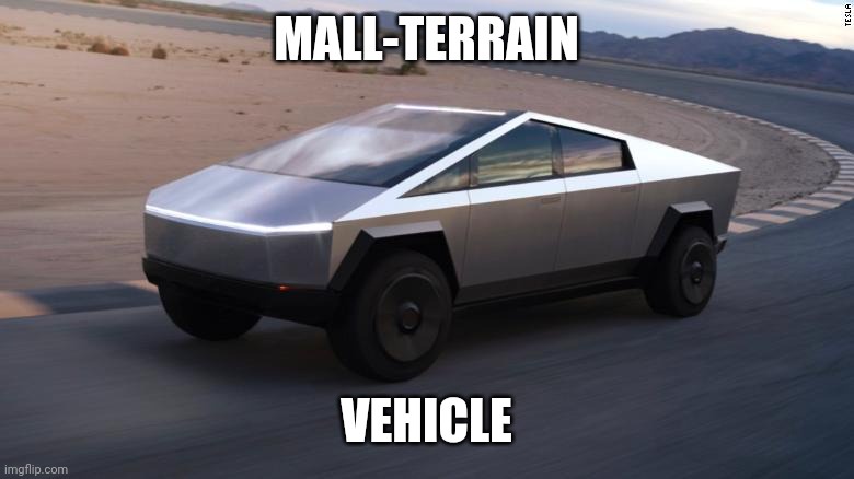 A silver, angular, futuristic-looking Tesla Cybertruck is shown driving on a paved road through a desert landscape with…