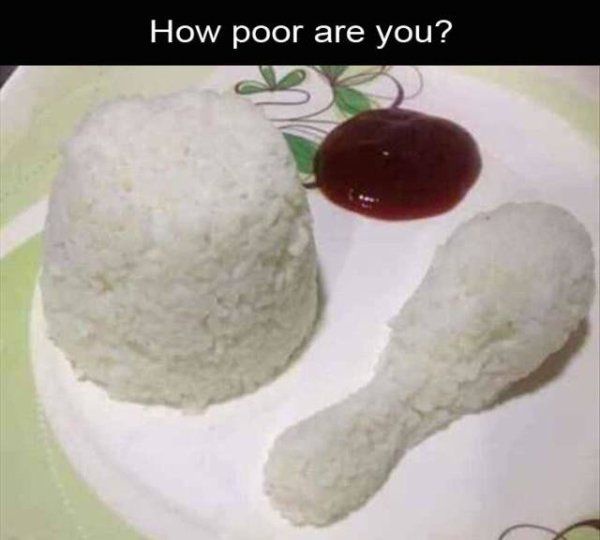 A plate holds a mound of white rice shaped like a human head and a smaller rice shape resembling a chicken leg, next to a…