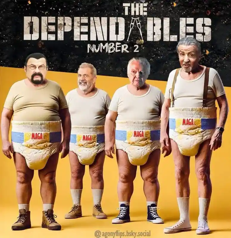 Four elderly men stand in a row wearing beige t-shirts, suspenders, and diapers with 'MAGA' printed on them. The diapers are…
