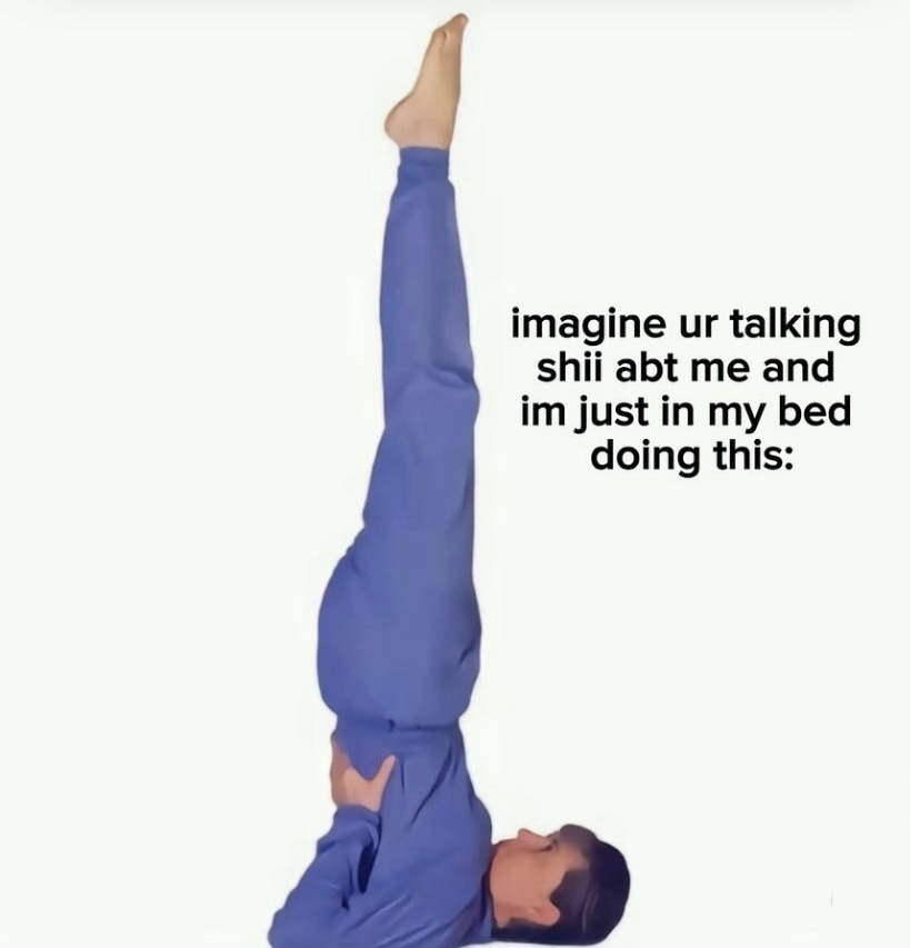 A person in blue pajamas is lying on their back in bed with their legs extended vertically upward, feet pointing toward the…