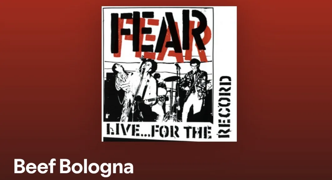The image displays the album cover for 'Fear' by the band Fear, featuring a black-and-white illustration of the band…
