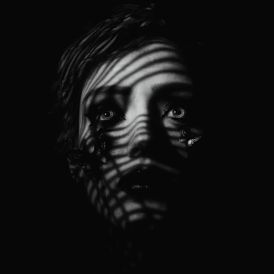 A black-and-white close-up of a person's face, partially obscured by dramatic striped shadows cast across their features…