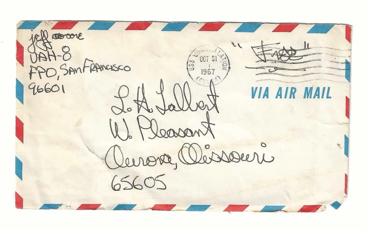 An old, slightly worn airmail envelope with red and blue diagonal stripes, showing handwritten return address 'Jeff Croone…