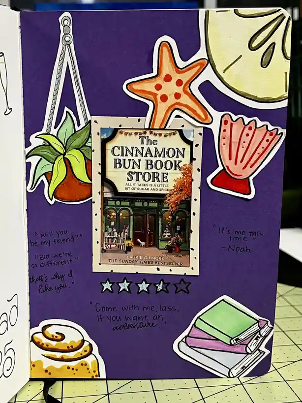 A purple book journal spread features a central image of the book cover for 'The Cinnamon Bun Book Store' by Laurie Gilmore…