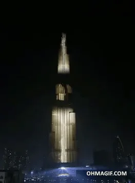 The Burj Khalifa in Dubai is illuminated at night with a countdown display using fireworks and lights, showing the numbers…