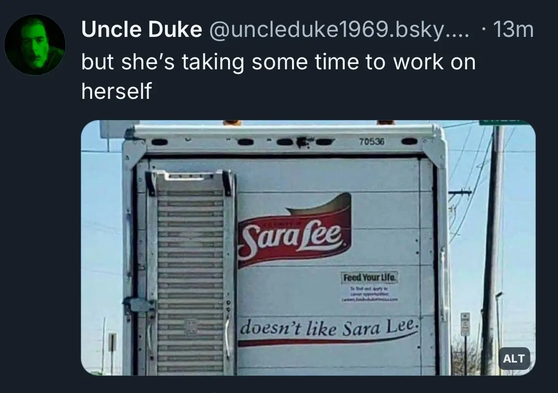A photo of the back of a white Sara Lee food truck with its loading ramp partially open. The truck has the Sara Lee logo and…