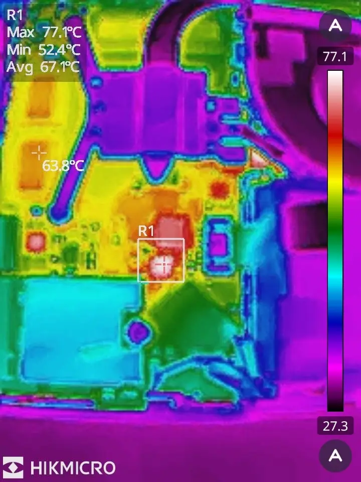 A thermal imaging scan of an electronic device's circuit board, showing temperature variations with a color gradient from…