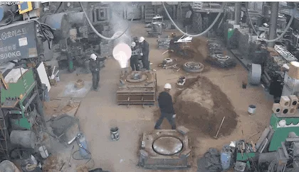 A sequence of images shows a factory worker walking toward a machine that initially emits a glowing lightbulb, which then…